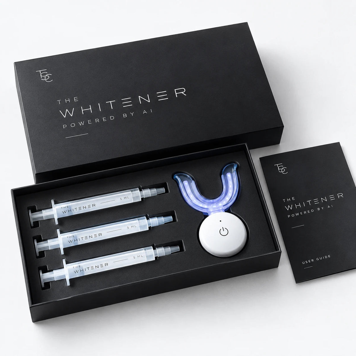 Coffret The Whitener ouvert : 3 seringues de gel, lampe LED et notice